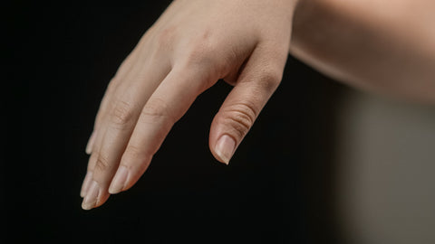 Close-up of natural nails and cuticles without nail polish
