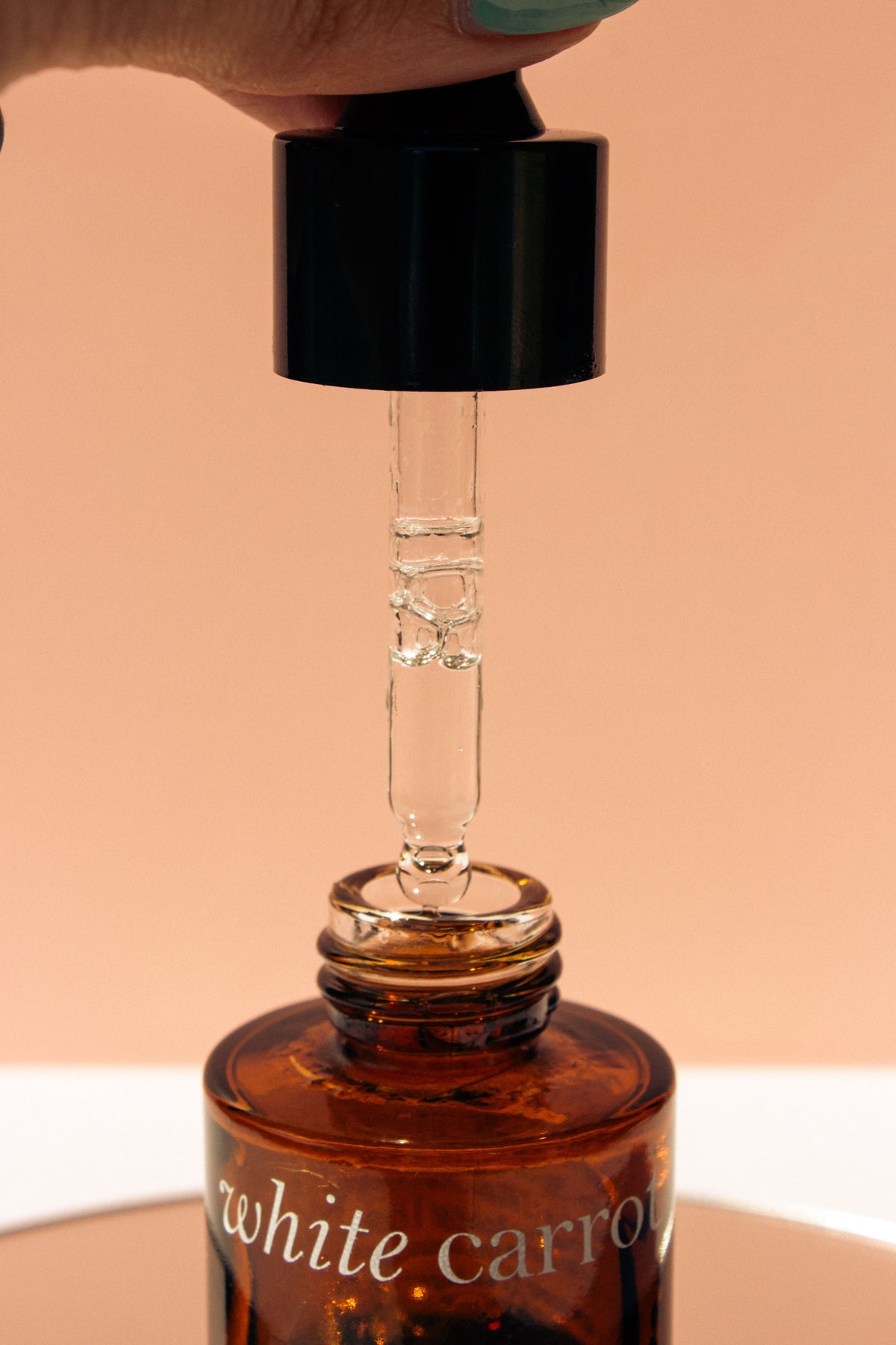 Close-up of a skincare serum dropper representing peptide formulas