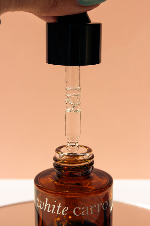 Close-up of a skincare serum dropper representing peptide formulas