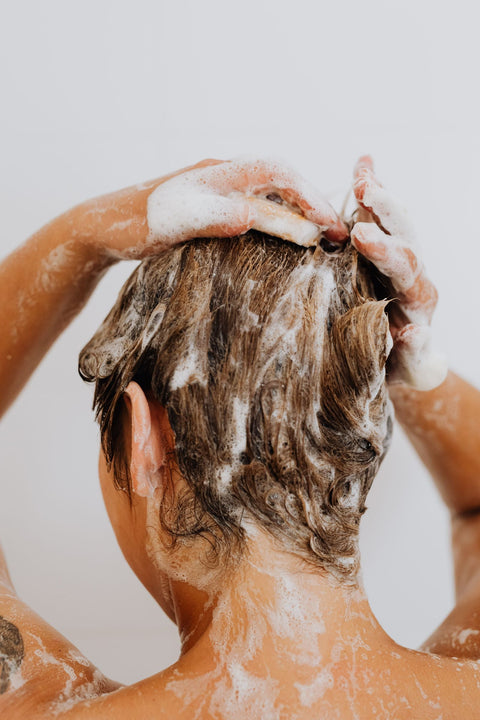 Woman gently shampooing her scalp in the shower, Pexels