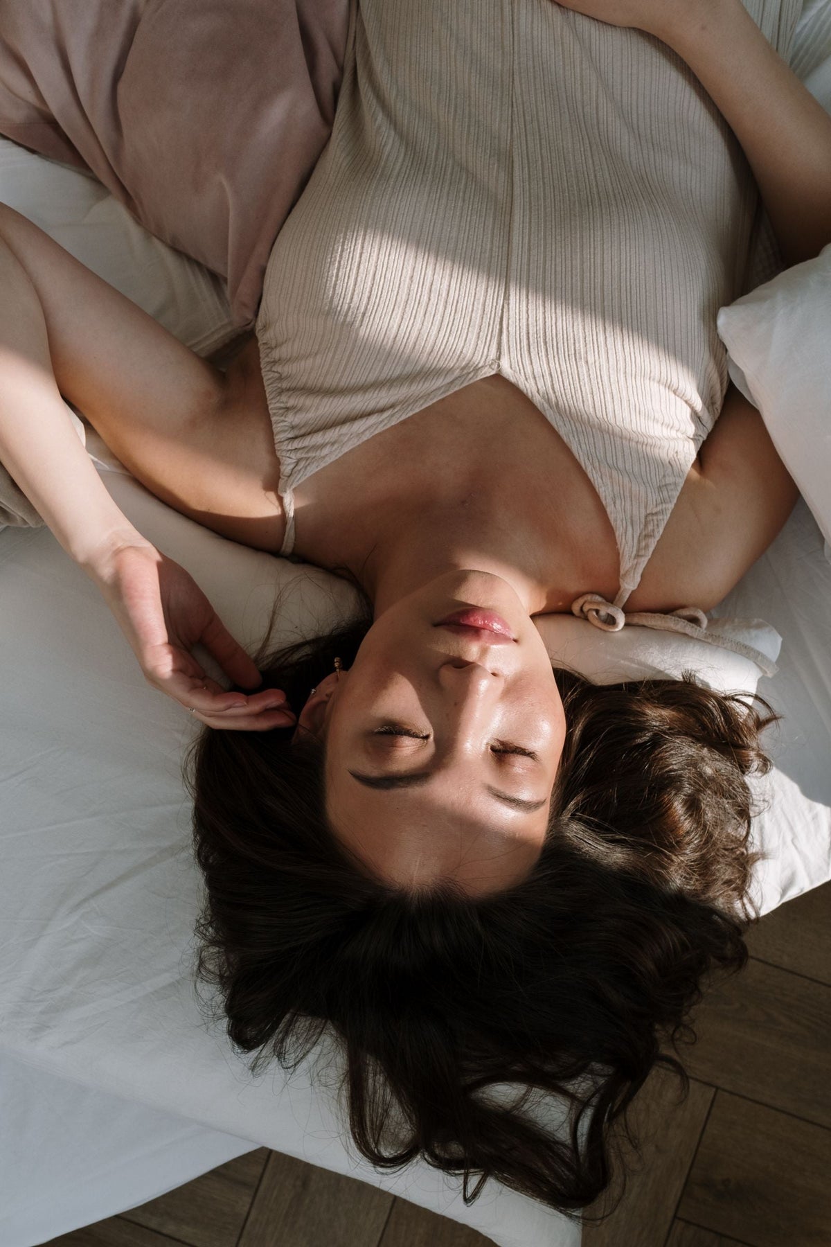 Woman sleeping in natural morning light. Photo: cottonbro studio via Pexels.