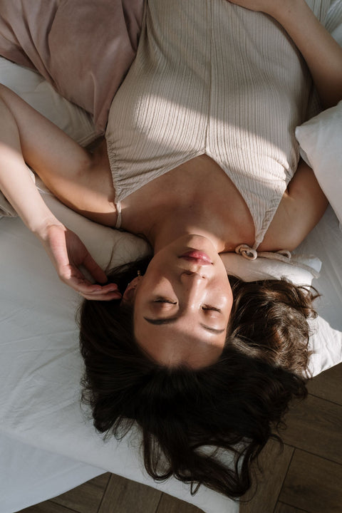 Woman sleeping in natural morning light. Photo: cottonbro studio via Pexels.